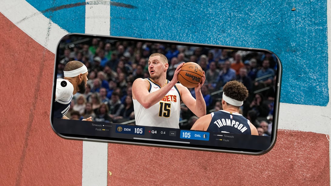 NBA League Pass on a smartphone laying on a basketball court