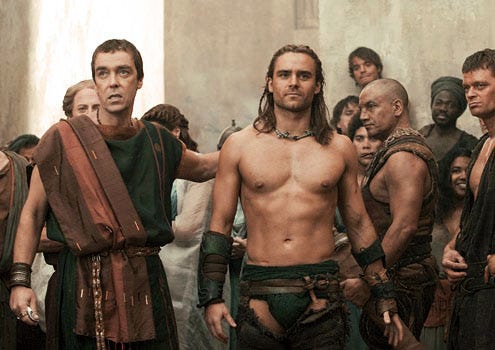 Spartacus: Gods of the Arena - John Hannah as Batiatus and Dustin Clare as Gannicus