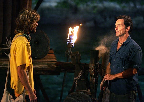 Survivor: Micronesia - Jeff Probst snuffs out Erik Reichenbach torch during tribal council during the thirteenth episode