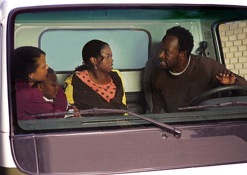 Jericho - Season 1 - "The Day Before" - Lennie James as Hawkins, April D. Parker as Darcy, Sterling Ardrey as Samuel and Jazz Raycole as Allison