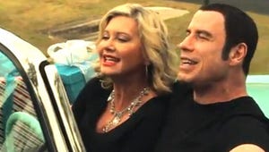 Watch John Travolta and Olivia Newton-John Line-Dance for Cheesy Holiday Music Video