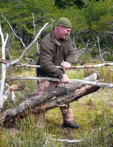 Dual Survival - Season 1 - Dave Canterbury setting a deadfall beaver trap