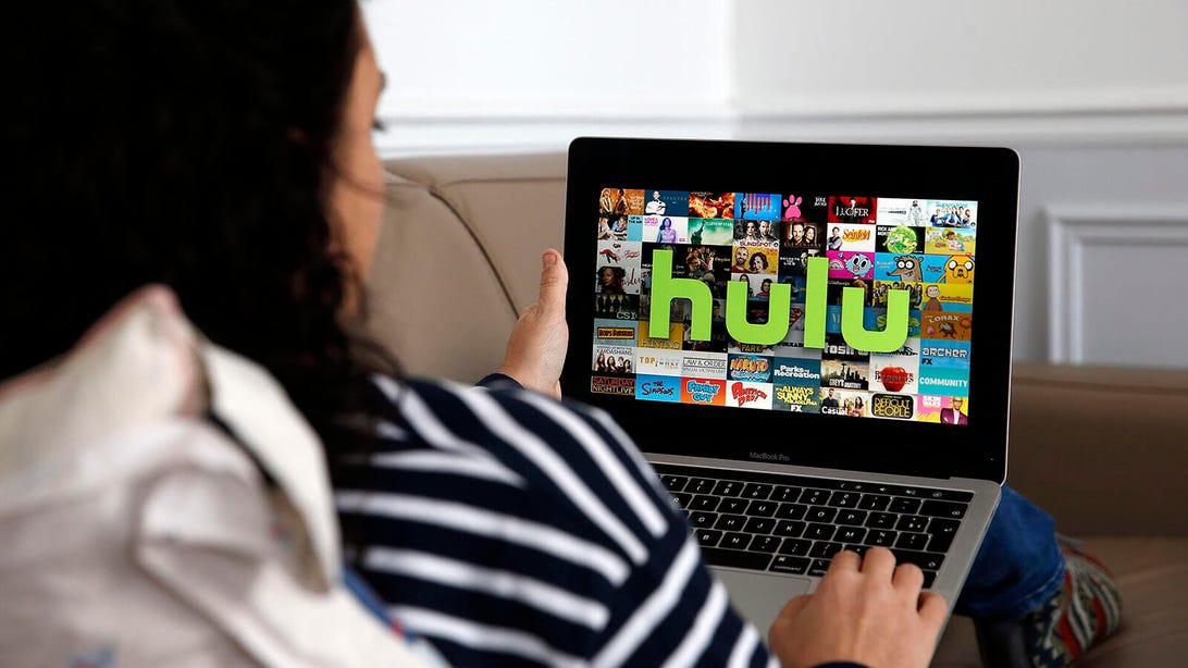 Woman watching Hulu on computer
