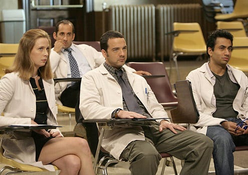 House - Season 4 - "Mirror, Mirror" - The team candidates (Anne Dudek, Peter Jacobson, Andy Comeau and Kal Penn) listen as Foreman introduces a new case
