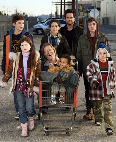 Shameless - Season1 - Cameron Monaghan as Ian, Emma Kenney as Debbie, William H. Macy as Frank, Blake and Brennan Johnson as Liam, Emmy Rossum as Fiona, Justin Chatwin as Steve, Jeremy White as Lip, and Ethan Cutkosky as Carl