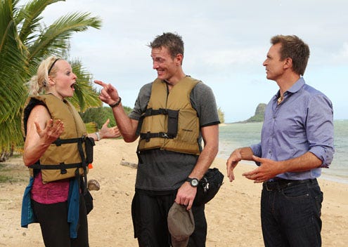 The Amazing Race 20 -  "It's a Great Place to Become Millionaires" - Host Phil Keoghan (right) informs Army couple Rachel and Dave (center) that they have just won The Amazing Race.
