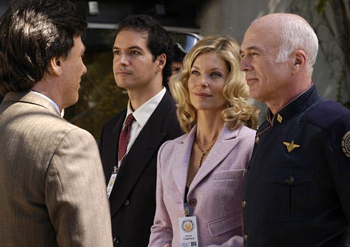 Battlestar Galactica - Season 1, "Colonial Day" - Richard Hatch as Tom Zarek, Kate Vernon as Ellen Tigh and Michael Hogan as Colonel Saul Tigh
