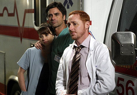 ER - Season 15, "The Book of Abby" - Linda Cardellini as Samantha Taggart, John Stamos as Tony Gates, Scott Grimes as Dr. Archie Morris