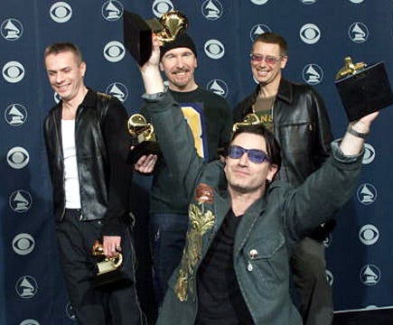 The Edge, Larry Mullen Jr., Adam Clayton and Bono of U2 with their three Grammys - 43rd Annual Grammy Awards - Feb. 21, 2001