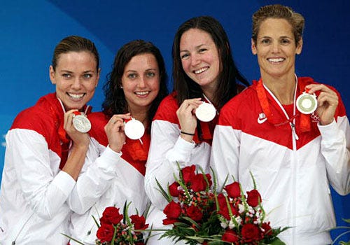 2008 summer Olympics - Natalie Coughlin, Rebecca Soni, Christine Magnuson and Dara Torres of the United States hold their silver medals in the Women's 50m Freestyle, August 17, 2008.