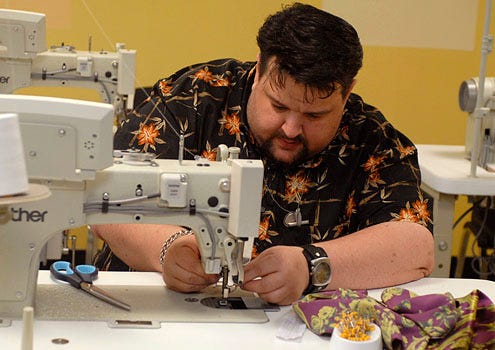 Project Runway - Season 4 - "Sew Us What You Got" - Chris March working with a sewing machine