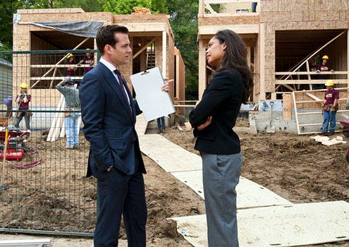 Suits - Season 1 - "Identity Crisis" - Gabriel Macht as Harvey Specter and Gina Torres as Jessica Pearson