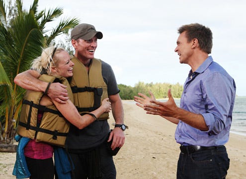 The Amazing Race 20 -  "It's a Great Place to Become Millionaires" - Host Phil Keoghan (right) informs Army couple Rachel and Dave (center) that they have just won The Amazing Race.
