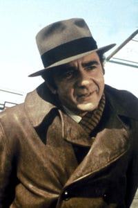 Michael Constantine as Gus Portokalos
