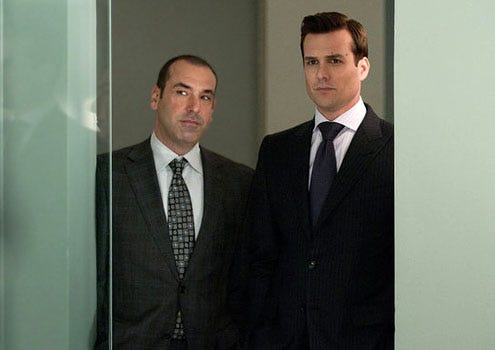 Suits - Season 1 - "Play The Man" - Rick Hoffman as Louis Litt and Gabriel Macht as Harvey Specter