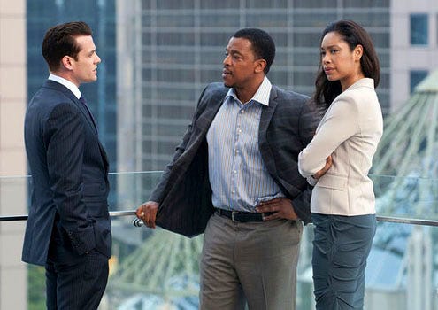 Suits - Season 1 - "Dirty Little Secrets" - Gabriel Macht as Harvey Specter, Russell Hornsby as Quentin Sands and Gina Torres as Jessica Pearson