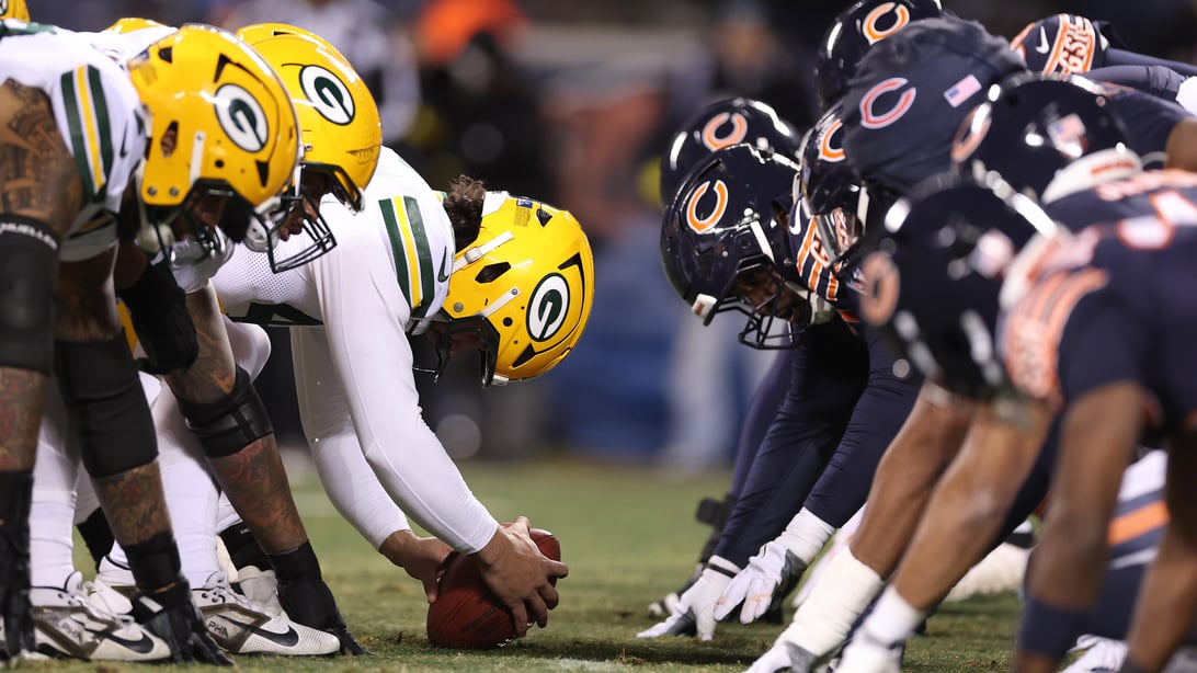 CHICAGO, ILLINOIS - DECEMBER 20: A detail of Chicago Bears and Green Bay Packers helmets at the line of scrimmage during the first quarter at Soldier Field on December 20, 2025 in Chicago, Illinois.