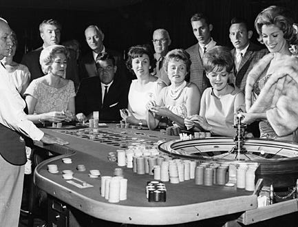 American Experience - "Las Vegas: An Unconventional History" - Gamblers playing roulette at the Sands casino.