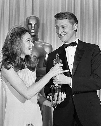 Leslie Caron and Mike Nichols - Caron presents Nichols with an Oscar for Best Director for The Graduate, Santa Monica. April 12, 1968