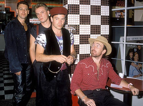 The Edge, Larry Mullen Jr., Adam Clayton and Bono of U2 - On set of the video for "Desire" - Los Angeles, CA - 1988